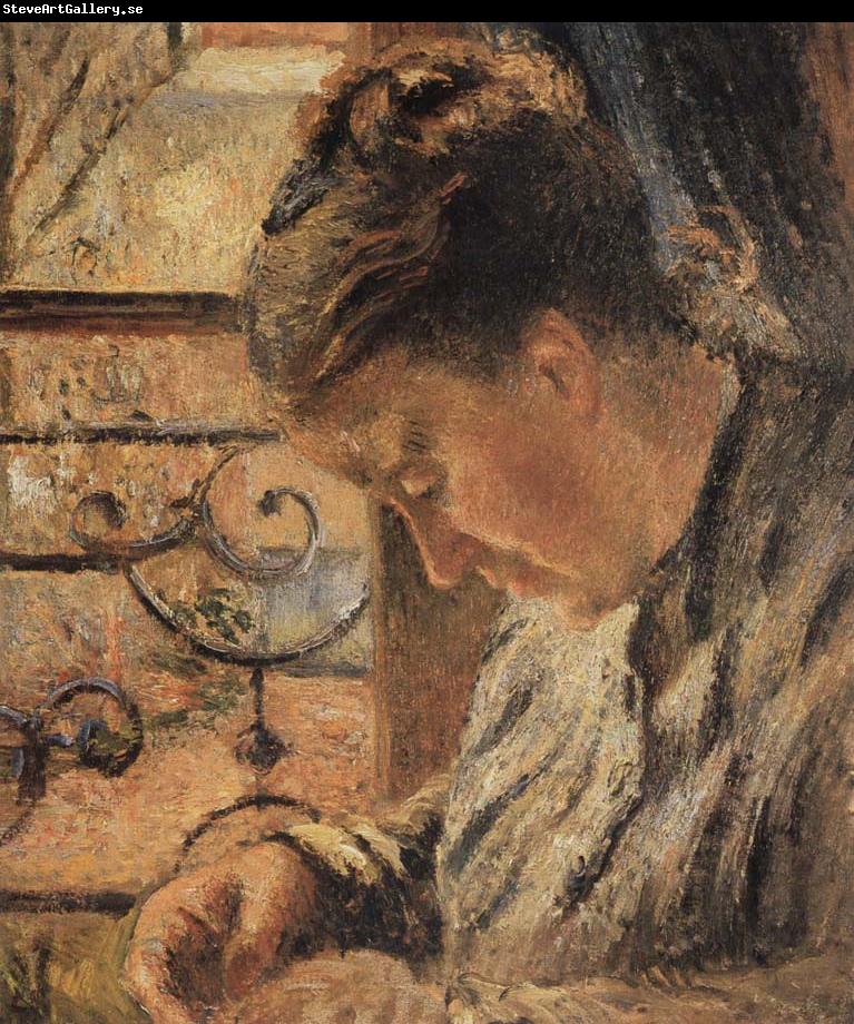 Camille Pissarro The Woman is sewing in front of the window